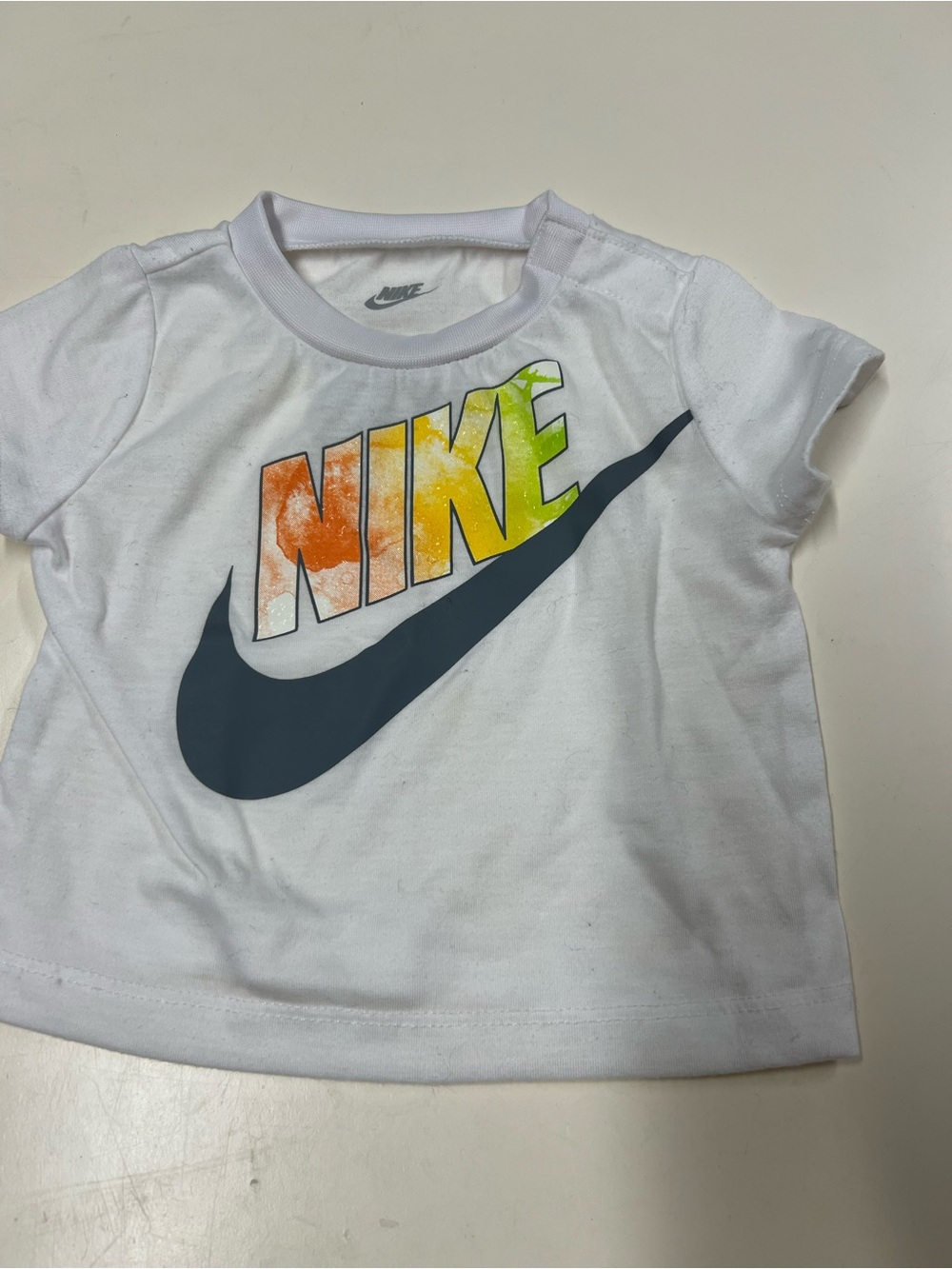 Nike White Kids Short Sleeve Tee with Orange-Yellow-Green Gradient Logo